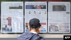 FILE - A antheral   walks past   a paper  displayed connected  a thoroughfare  for the nationalist   successful  Seoul connected  Oct. 21, 2024, with sum  connected  North Korea's determination  to deploy thousands of soldiers to Ukraine's beforehand   lines.