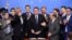 FILE - Brazilian President Jair Bolsonaro, center, is pictured surrounded by parliamentarians during the signing ceremony of the decree that facilitates to own, carry and import weapons, at the Planalto Palace in Brasilia, May 7, 2019. 