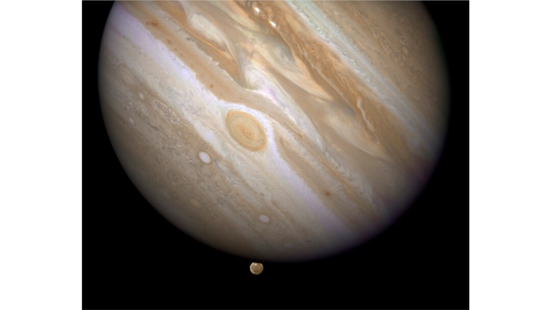 FILE - The planet Jupiter is shown with one of its moons, Ganymede (bottom), in this NASA handout taken April 9, 2007.