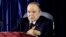 FILE - President Abdelaziz Bouteflika gestures during a swearing-in ceremony in Algiers, April 28, 2014. 