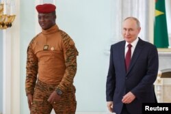 FILE - Russia's President Vladimir Putin and Burkina Faso's interim President Ibrahim Traore meet following the Russia-Africa summit in Saint Petersburg, Russia, July 29, 2023.