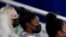 United States gymnast Simone Biles sits on the stands during the artistic gymnastics women's all-around final at the 2020 Summer Olympics, July 29, 2021, in Tokyo, Japan. 
