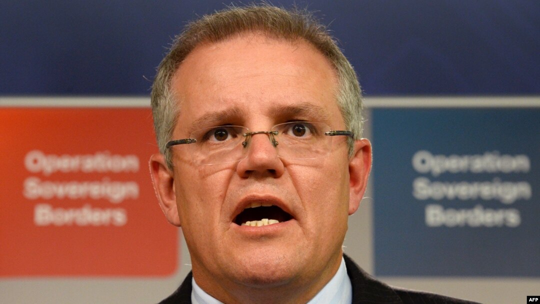 FILE - Australian Immigration Minister Scott Morrison speaks during a press conference in Sydney.
