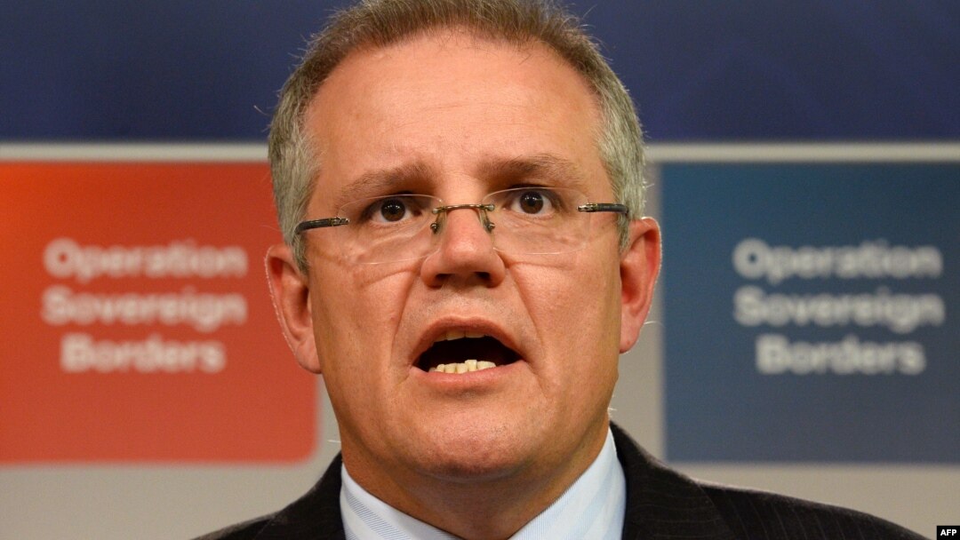 FILE - Australian Immigration Minister Scott Morrison speaks during a press conference in Sydney.