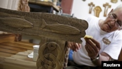 Bosnian wood carver-sculptor Salem Hajderovac works on a chair for Pope Francis, at his workshop in Zavidovici, Bosnia and Herzegovina, May 25,2015. 