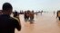 FILE; In a previous incident, rescue workers carry a victim of a boat accident in Wara Kebbi , Nigeria, Thursday, May 27, 2021. More than 100 people are missing and feared dead after a boat with more than 165 passengers, sank as it was traveling in Nigeria's northern Kebbi state,