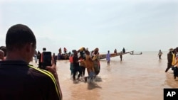 FILE: In a previous incident, rescued workers carry a victim of a boat accident in wara Kebbi , Nigeria, Thursday, May 27, 2021. More than 100 people were missing and feared dead after a boat broke and sank as it was traveling in Nigeria's northern Kebbi state, 