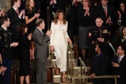 First lady Melania Trump ignored the rule against wearing white after Labor Day by appearing in a white pantsuit at the 2018 State of the Union address in Washington, Jan. 30, 2018.