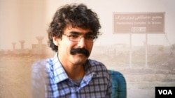 Iranian Gonabadi Dervish journalist Mohammad Sharifi Moghadam is seen in this undated photo set against the backdrop of the Greater Tehran Penitentiary.
