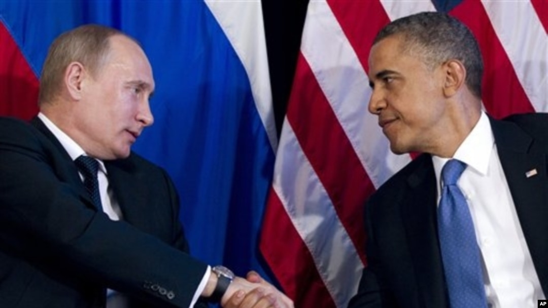 President Barack Obama shakes hands with Russian President Vladimir Putin, G20 Summit, Los Cabos, Mexico, June 18, 2012.
