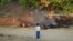 Unidentified man photographs bodies burning in the wake of sectarian riots in Meikhtila, Burma, March 22, 2013.
