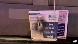 This image released by the Portland Police Bureau shows a ballot box after an incendiary device was discovered inside, in Portland, Oregon, Oct. 28, 2024.