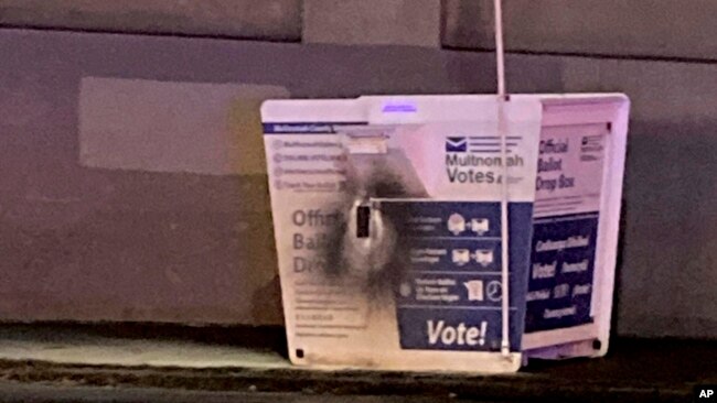 This image released by the Portland Police Bureau shows a ballot box after an incendiary device was discovered inside, in Portland, Oregon, Oct. 28, 2024.