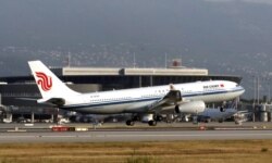 FILE - An Air China Airbus lands at Nice Airport during the Air China's inaugural flight from Beijing to Nice, France, Aug. 2, 2019.
