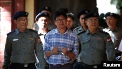 Detained Reuters journalist Wa Lone arrives at a court hearing in Yangon, Myanmar, January 23, 2018. 