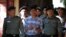Detained Reuters journalist Wa Lone arrives at a court hearing in Yangon, Myanmar, January 23, 2018. 