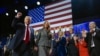 Former President Donald Trump gestures as he walks with former first lady Melania Trump at an election night watch party at the Palm Beach Convention Center, Wednesday, Nov. 6, 2024, in West Palm Beach, Fla. (AP Photo/Evan Vucci)