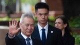 Chinese Vice Premier Liu He (L) arrives at the the Office of the United States Trade Representative for tariff negotiations in Washington DC on May 9, 2019.