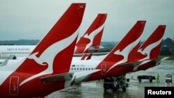 FILE - Qantas aircraft are seen on the tarmac at Melbourne International Airport in Melbourne, Australia, Nov. 6, 2018. 