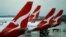 FILE - Qantas aircraft are seen on the tarmac at Melbourne International Airport in Melbourne, Australia, Nov. 6, 2018. 