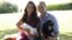 A handout picture released on August 19, 2013 by Kensington Palace shows Prince William, Duke of Cambridge, his wife Catherine, Duchess of Cambridge, with their newborn baby boy, Prince George of Cambridge, Tilly the retriever (L), a Middleton family pet