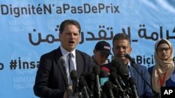 FILE - UNRWA’s commissioner-general, Pierre Kraehenbuehl, left, gives a press conference to launch a global campaign to support UNRWA, at the UNRWA Rimal Girls Preparatory School in Gaza City, Jan. 22, 2018.