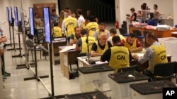 Election staff count ballots in Tirana, Albania, June 26, 2017. 