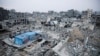 Houses destroyed in previous Israeli strikes lie in ruin, ahead of a ceasefire set to take effect on Sunday, in Khan Younis in the southern Gaza Strip January 16, 2025. 