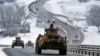 A convoy of Russian armored vehicles moves along a highway in Crimea, Jan. 18, 2022.