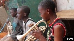 The children living at M-lisada practice their instruments every day, Kampala, Uganda, Oct. 11, 2013. (VOA/Hilary Heuler)