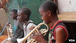 Children play their instruments every day in Kampala, Uganda.