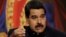 FILE - Venezuelan President Nicolas Maduro talks to reporters during a news conference at Miraflores Palace in Caracas, Aug. 22, 2017. 