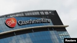 FILE - General view outside GlaxoSmithKline (GSK) headquarters in Brentford, Britain, May 4, 2020.