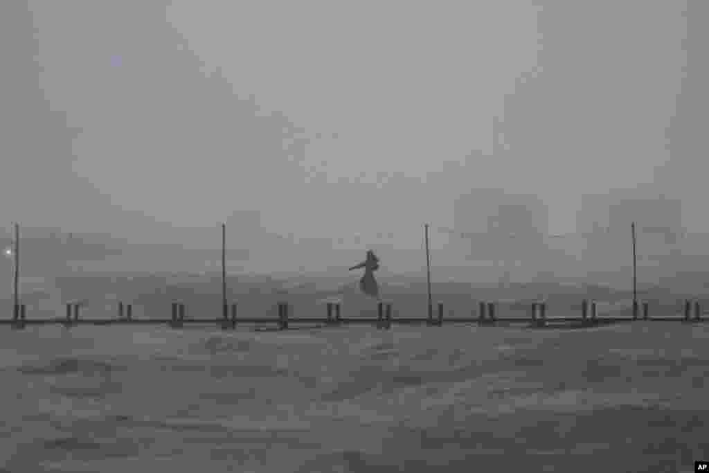 A sculpture of Poseidon stands in the ocean after the eye of Hurricane Milton passed off the coast of Progreso, Yucatan state, Mexico, Oct. 8, 2024.