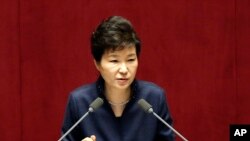 FILE - South Korean President Park Geun-hye delivers a speech at the National Assembly in Seoul, South Korea, following North Korea's recent nuclear test and long-range rocket launch. 