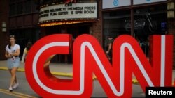 FILE - The CNN logo stands outside the venue of the second Democratic 2020 U.S. presidential candidates debate, at the Fox Theater in Detroit, July 30, 2019.