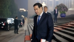 U.S. Secretary of State Marco Rubio walks outside the Great Hall of the People on the day of a state banquet with President Trump.