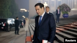 U.S. Secretary of State Marco Rubio walks outside the Great Hall of the People on the day of a state banquet with President Trump.