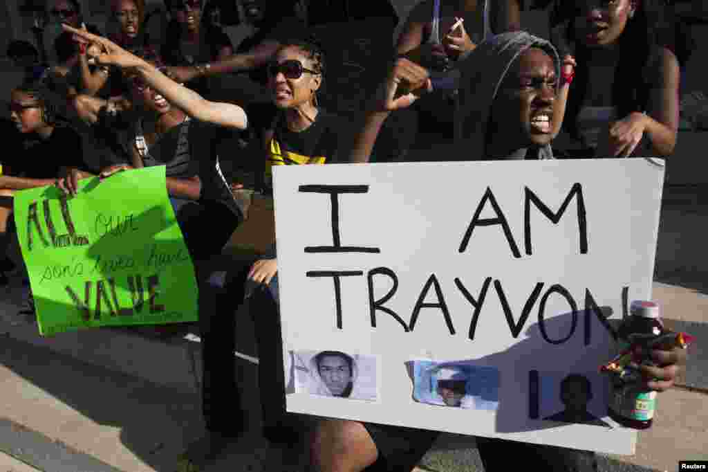 Protesters rally in New York's Brooklyn borough, in response to the acquittal of George Zimmerman in the shooting death of Trayvon Martin trial, July 14, 2013. Zimmerman, cleared by a Florida jury of six women, still faces public outrage, a possible civil suit and demands for a federal investigation.