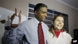 FILE — Cuba's dissident Oscar Elias Biscet, left, embraces his wife Elsa Morejon after being released from jail in Havana, Cuba, March 11, 2011. On Tuesday, he was arrested by Cuban authorities and is being held without explanation, said the U.S. Agency for Global Media.