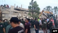 Rescuers look for trapped workers after a seven-story building under construction collapsed in southern Cambodia's coastal Kep province on Jan. 3, 2020.