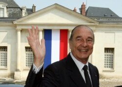 FILE - France's President Jacques Chirac waves as he leaves a French citizenship naturalization ceremony in Tours, central France, June 29, 2006.