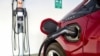 FILE - A Chevrolet Volt hybrid car is hooked up at a ChargePoint charging station at a parking garage in Los Angeles, Oct. 17, 2018. 