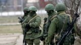Unidentified gunmen guard Ukraine&#39;s infantry base in Privolnoye, Ukraine, March 2, 2014.&nbsp;