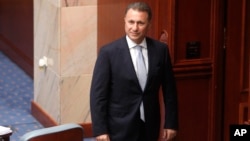 FILE - In this Oct. 19, 2018 file photo, Nikola Gruevski, the country's former Prime Minister, looks in on the Macedonian Parliament in the capital Skopje. 