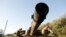 FILE - An Israeli tank in Golan along Israel-Syrian border 