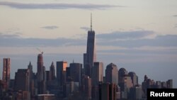 FILE - A passenger boat navigates the Hudson River in front of One World Trade Center in Lower Manhattan in New York, April 17, 2015. 