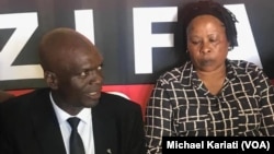 ZIFA president Felton Kamambo and Board member, barbara Chikosi.