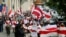 File - Activists march during a rally in support of Belarusian anti-government movement in Kyiv, Ukraine, May 30, 2021. 