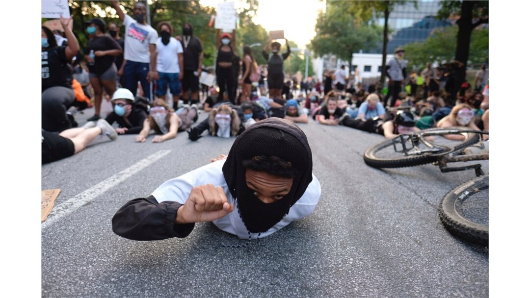 Protesters lie on a street during a demonstration June 1, 2020, in Atlanta over the death of George Floyd, who died May 25 in Minneapolis.
